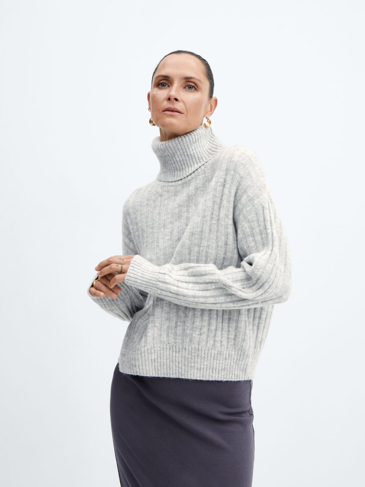 Rolled neck cable sweater