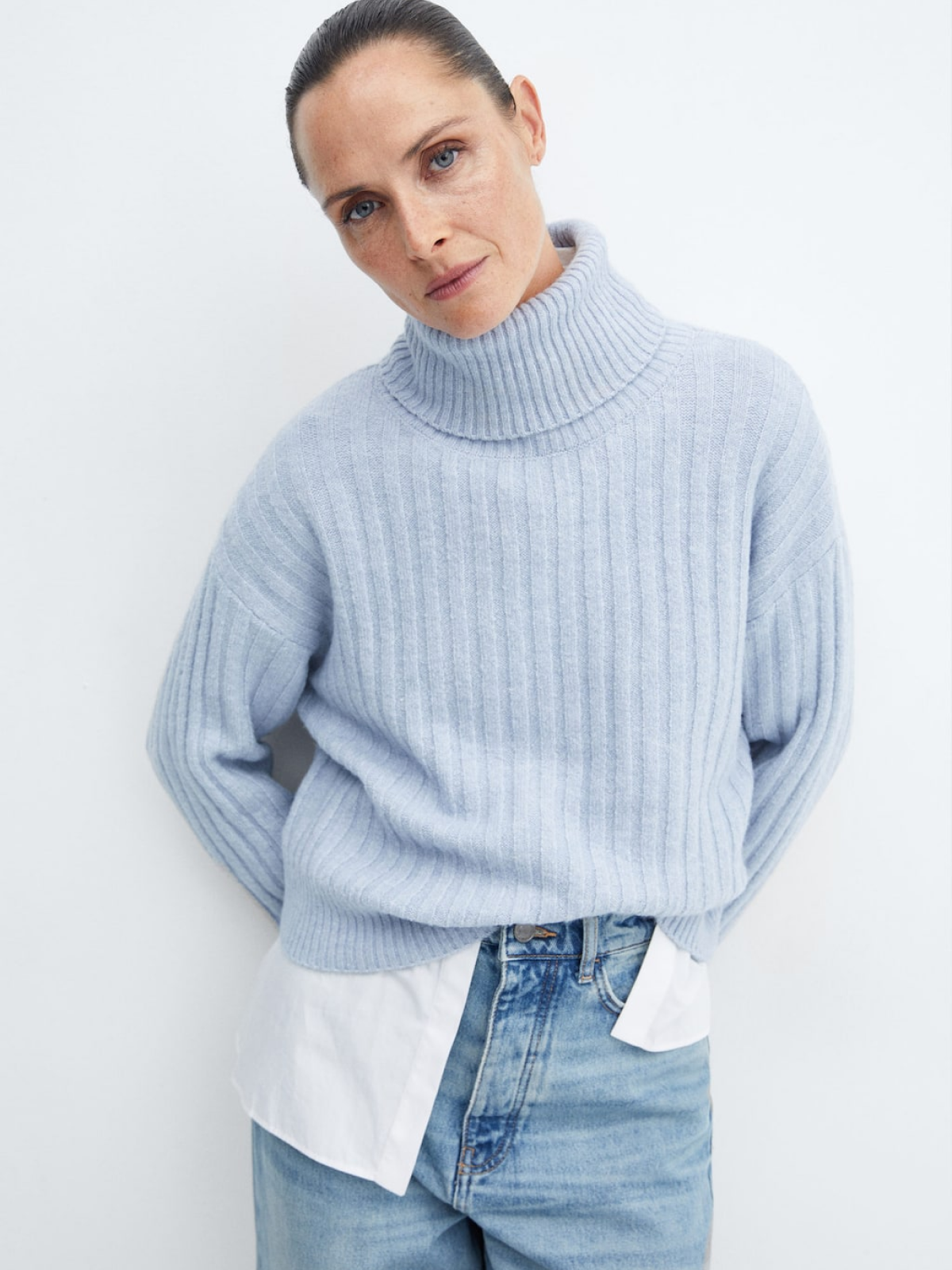 Rolled neck cable sweater
