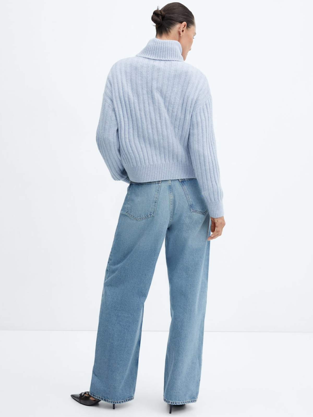 Rolled neck cable sweater