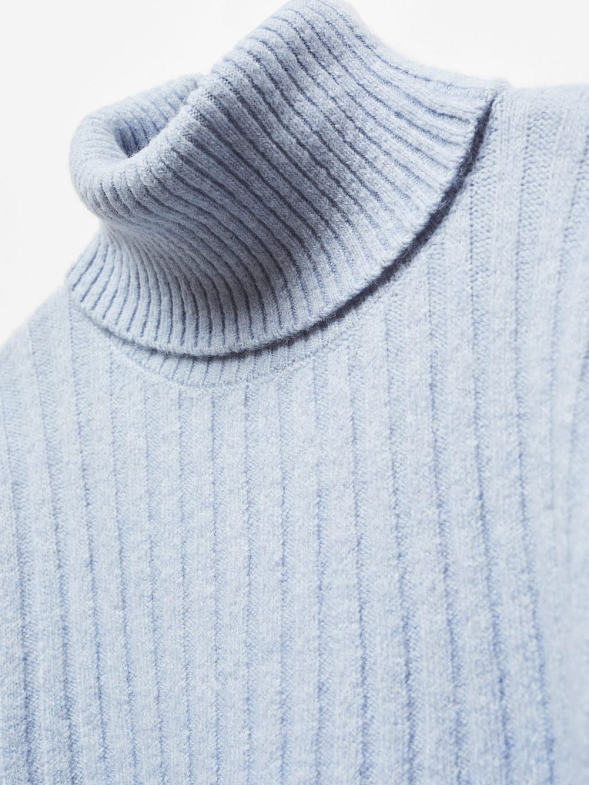 Rolled neck cable sweater